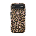 Close-up of photographic leopard rosettes and satin bows on a tough case