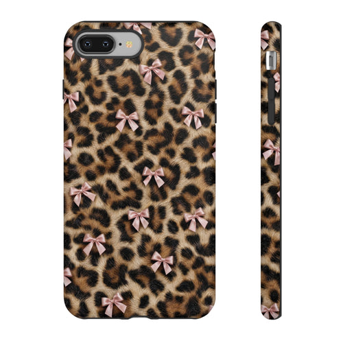 Coquette leopard print phone case with a pink ribbon bow, shown on iPhone 8 Plus