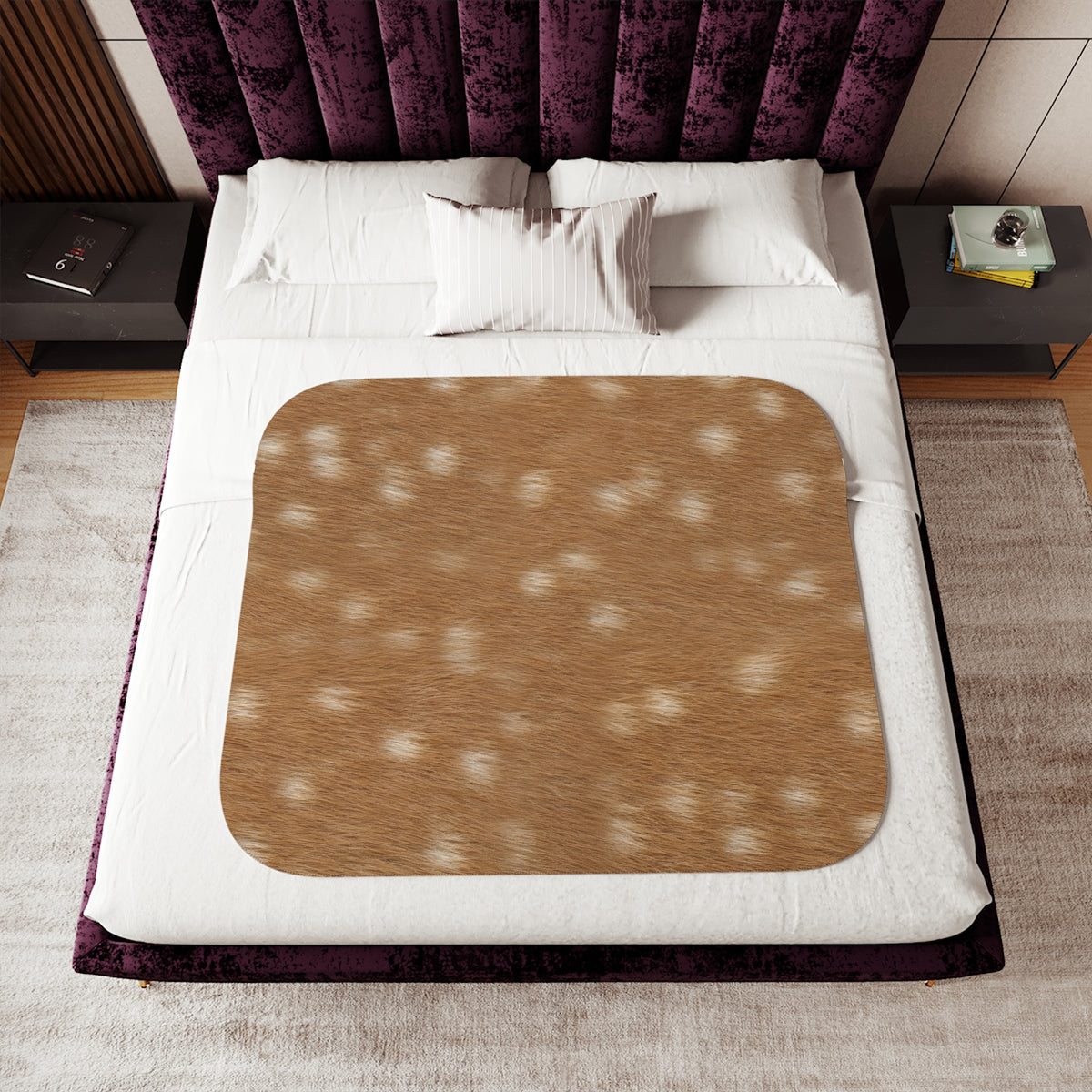 Fawn deer print blanket detail — creamy white dapples on russet tan