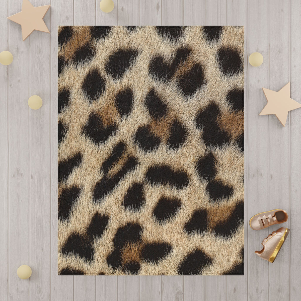 Leopard print blanket detail — individual hair strands and irregular rosettes