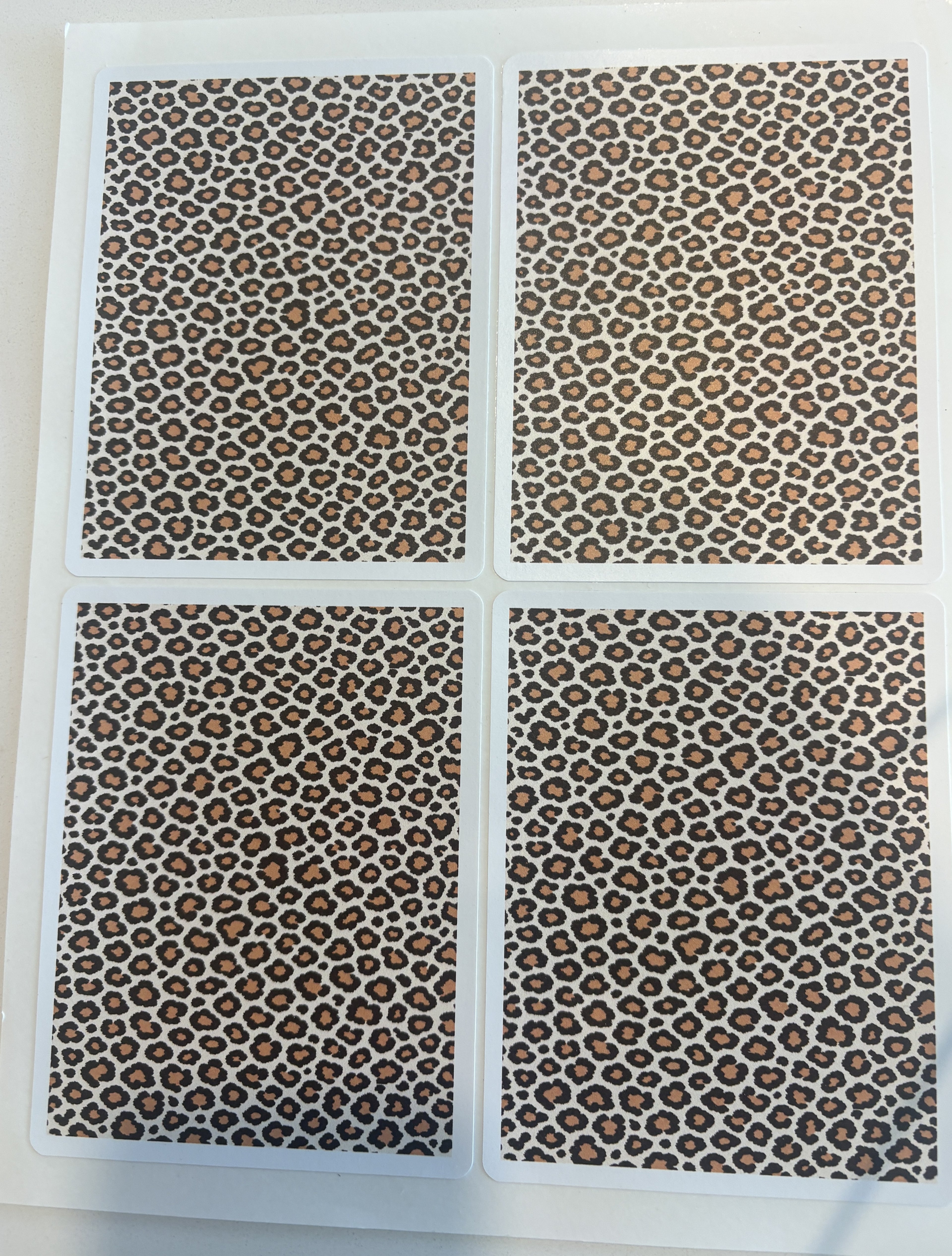 Leopard print sticker sheet in warm-neutral tones — four die-cut leopard panels