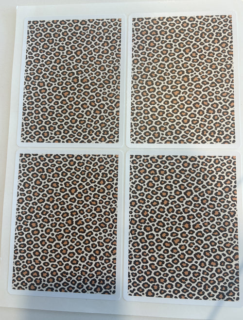 Leopard print sticker sheet in warm-neutral tones — four die-cut leopard panels