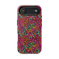 Close-up of bold Y2K rainbow leopard rosettes on a tough case