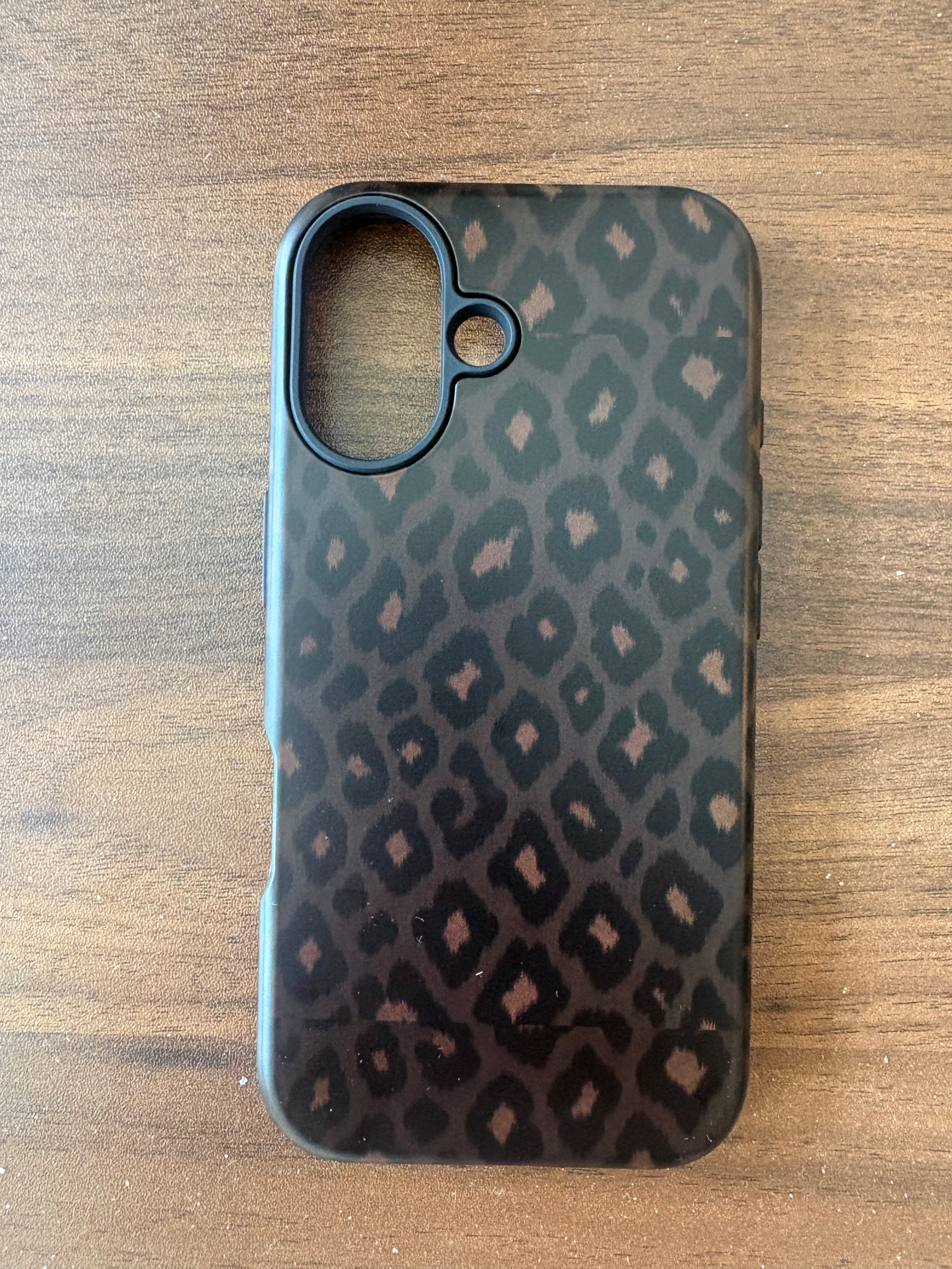 Tawny After Dark black leopard print phone case — real product photo