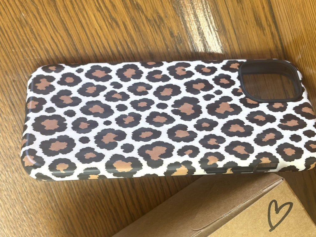Leopard print phone case angled view showing matte finish and camera cutout