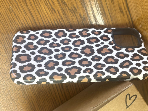 Leopard print phone case angled view showing matte finish and camera cutout